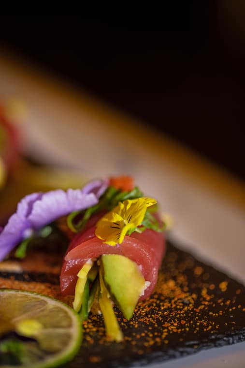 Tuna and avocado roll garnished with flowers
